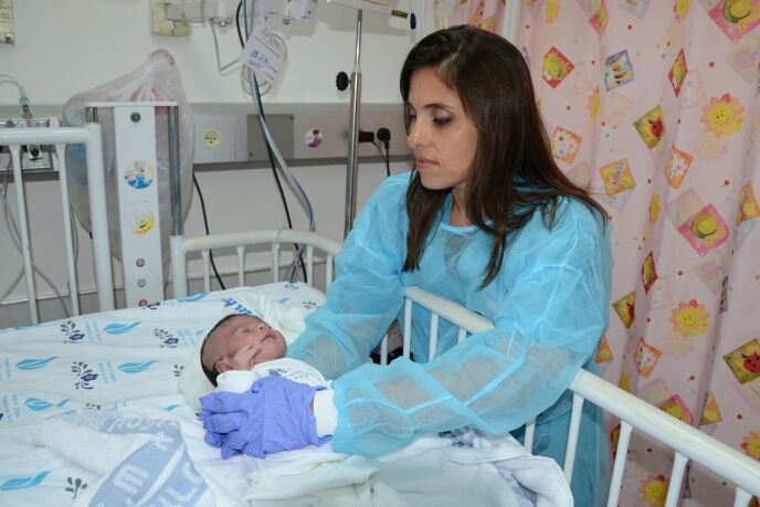 Irena Nosel caring for a baby from Gaza at Israel’s Wolfson Medical Center.