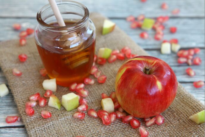 Honey, apples and pomegranate are found on most Jewish tables for Rosh Hashanah. Photo by Liron Almog/FLASH90