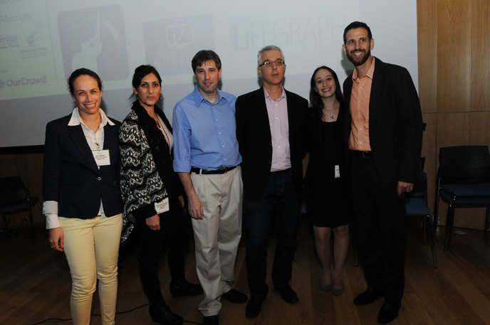 Tal Givoly, Medivizor's Co-Founder and CEO (blue shirt) is flanked by mHealth Israel organizers. 