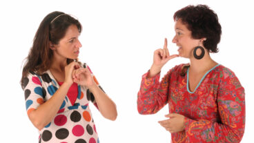 Sign language. Photo via www.shutterstock.com