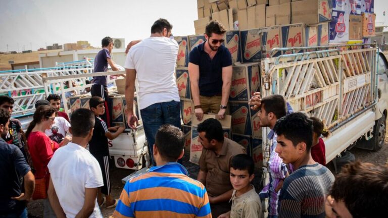 IsraAID relief volunteers distributing supplies in Iraq last month. Photo: courtesy