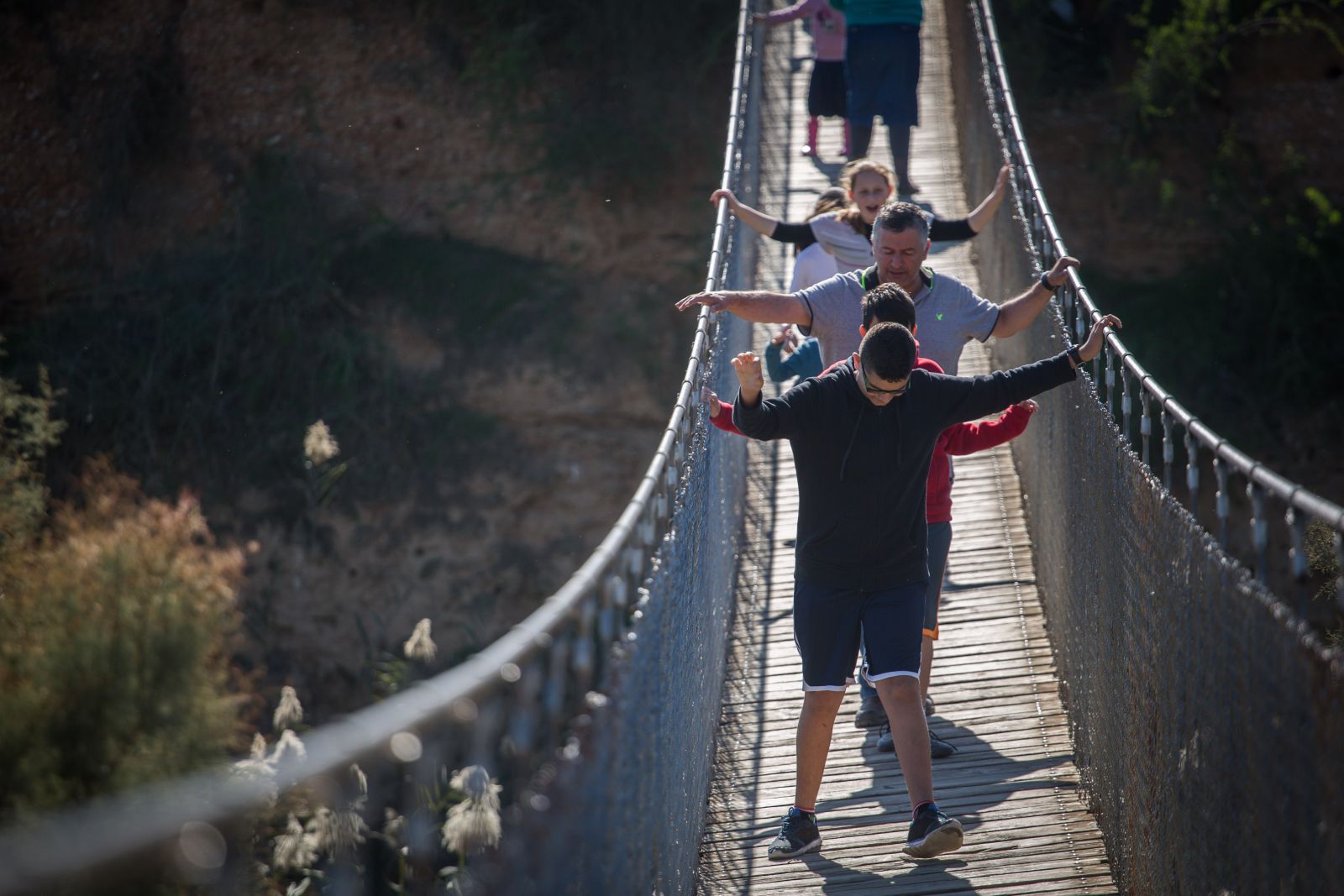 Israelis cross the hanging bridge at Besor River. Photo by Hadas Parush/FLASH90 