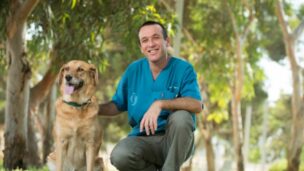 Dr. Yoel and one of his cancer-sniffing friends. Photo by Dani Machlis/BGU