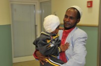 Abdulrazak and his father at the Israeli hospital. Photo by Rony Albert