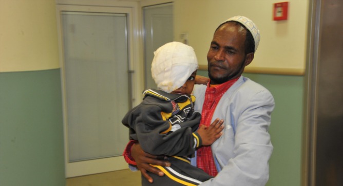 Abdulrazak and his father at the Israeli hospital. Photo by Rony Albert