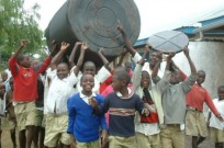 Children in Kenya helping to install an Israeli system for collecting rainwater from the roofs of schools.