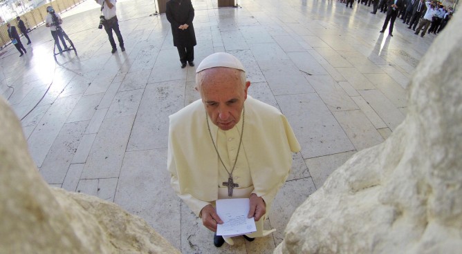 Pope Francis seen praying in front of the Western Wall.  (Kobi Gideon/GPO/FLASH90)