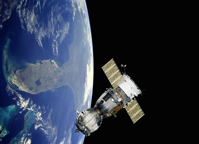 A satellite orbiting earth. Photo by www.shutterstock.com