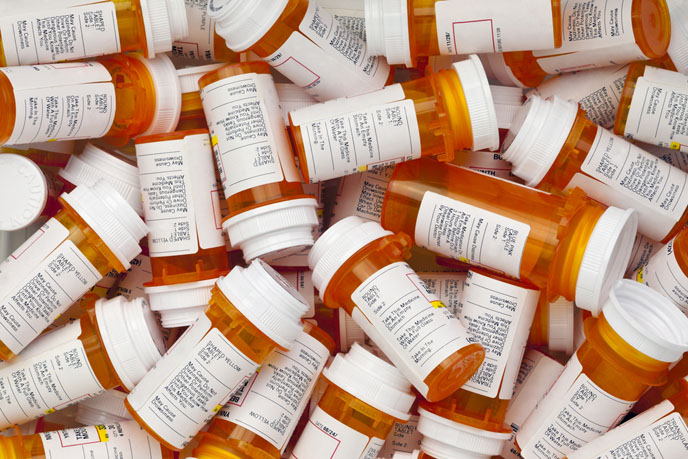 Dozens of prescription medicine bottles in a jumble. (Shutterstock.com)