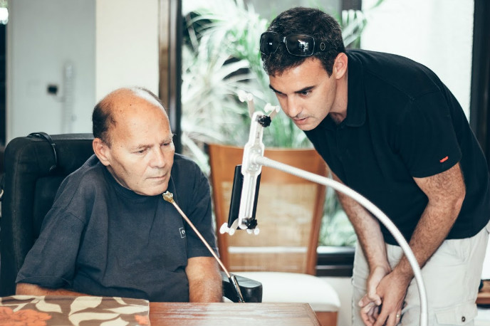 Sesame Enable CEO Oded Ben Dov with a phone user. 