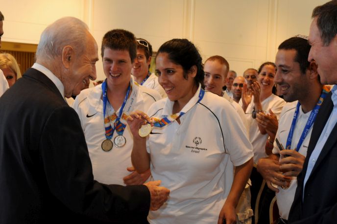  Israeli President Shimon Peres greeting athletes returning from the Special Olympics World Summer Games in Athens in 2011. Photo by GPO/Flash90.