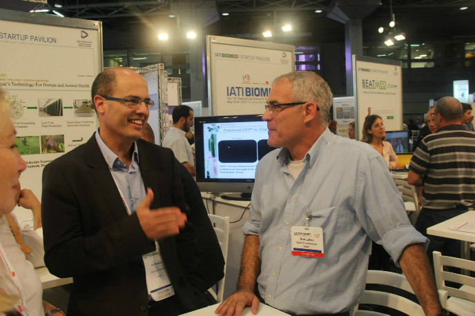 Avi Hasson, chief scientist in the Ministry of Economy, speaking with Quiet Therapeutics’ Ron Lahav at IATI Biomed 2015. 