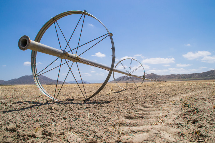 Water irrigation pipes on parched southern Californian farmland. Photo by Eddie J. Rodriguez, www.shutterstock.com