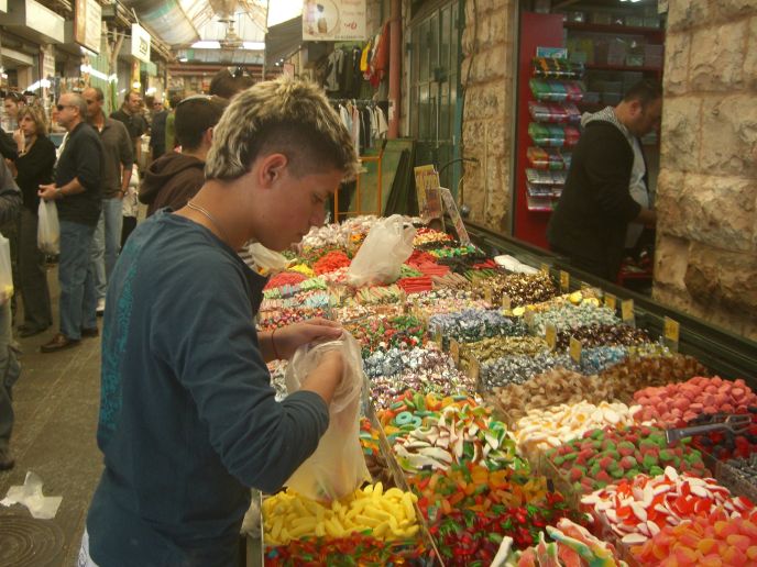 Choosing sweets at Machane Yehuda market in Jerusalem. Photo courtesy