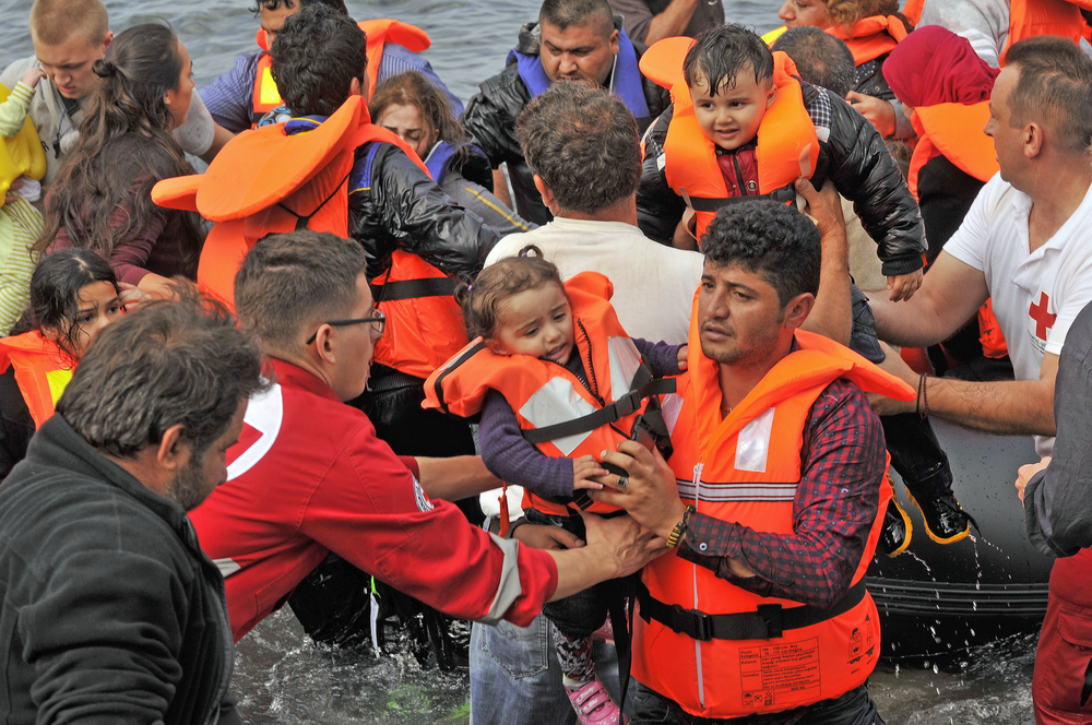 Syrian refugees landing in Greece. Photo via www.shutterstock.com