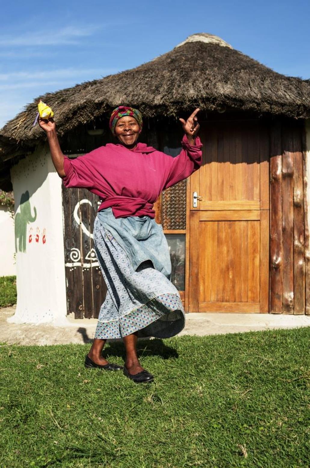 A Xhosa woman seen on a village tour conducted by the community-based cooperative Mdumbi Backpackers in South Africa. Proceeds support the local community. Photo courtesy of visit.org