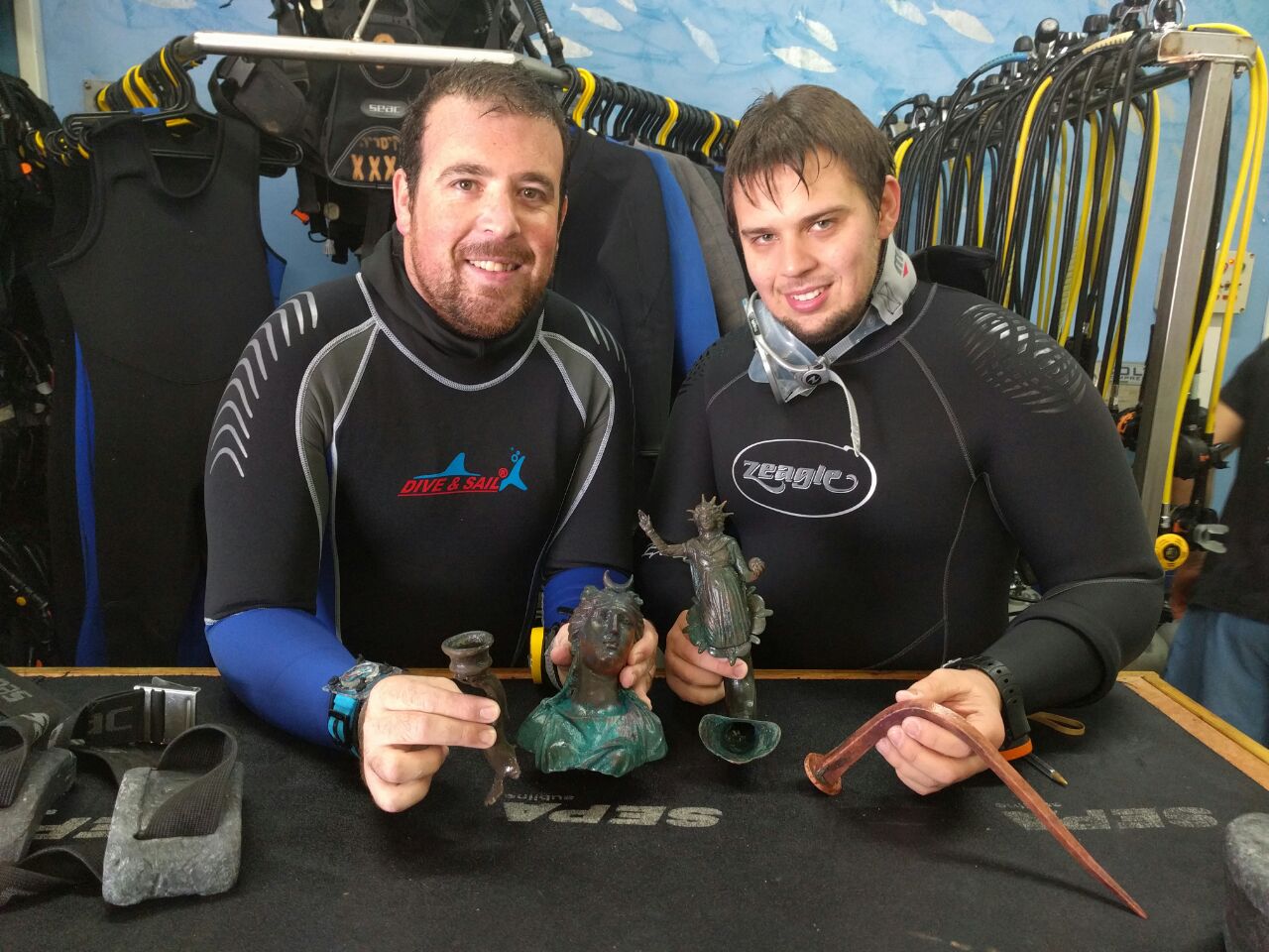 Exemplary citizenship: Divers Ran Feinstein (right) and Ofer Ra‘anan after the discovery. Photo courtesy of the Old Caesarea Diving Center