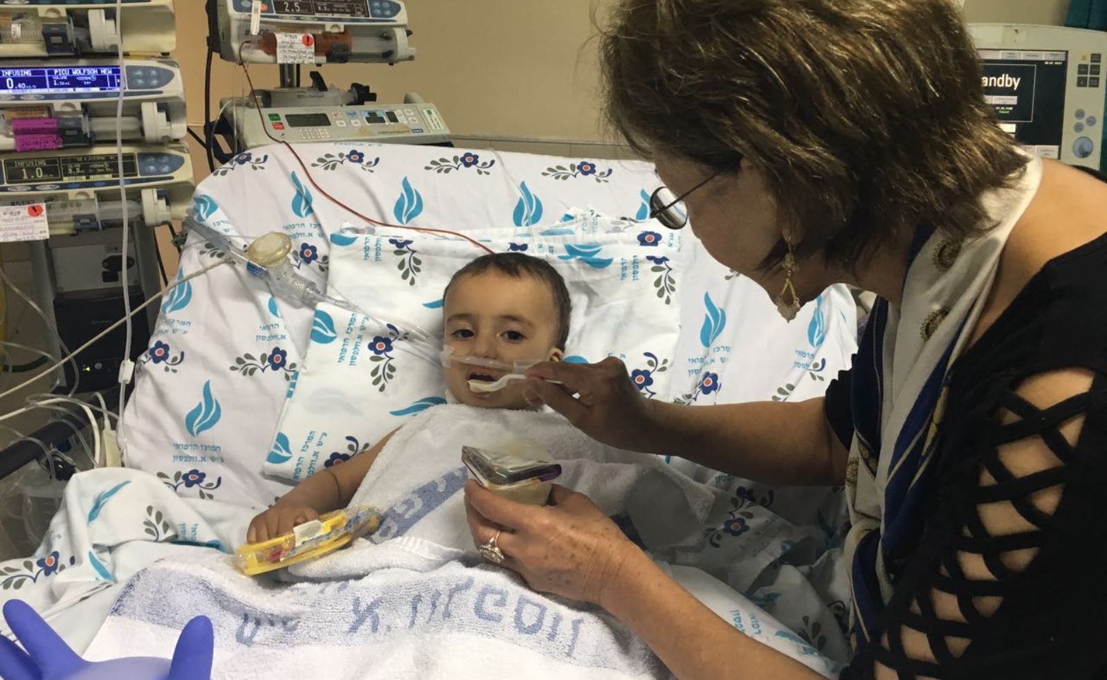 California Rotary Club member Fary Moini, formerly a cardiology nurse from Iran, volunteered to care of Yehia. Photo courtesy of SACH 