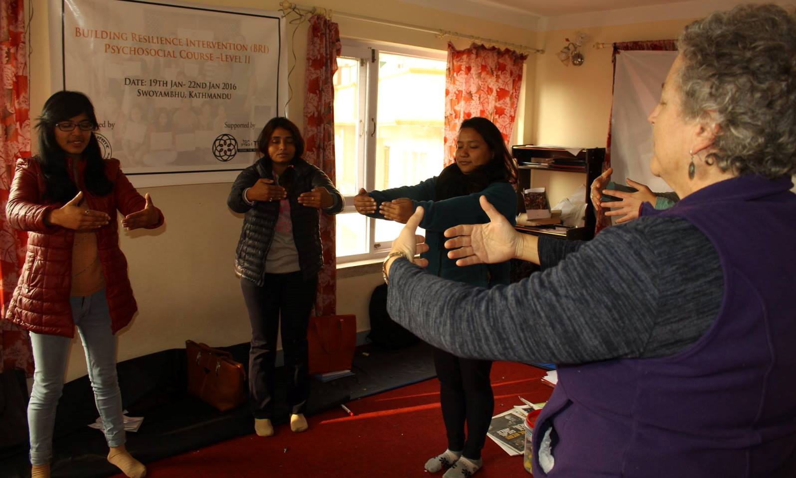  Naomi Baum, retired founder-director of the Resilience Unit at the Israel Center for the Treatment of Psychotrauma of Jerusalemâ€™s Herzog Hospital, teaching resilience techniques to Nepalese women. Photo via Facebook