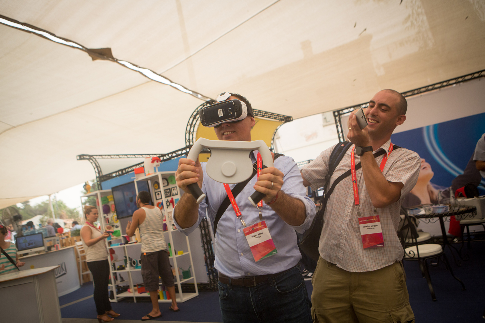 DLD Tel Aviv participants trying out new technologies. Photo by Miriam Alster/FLASH90