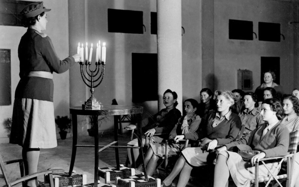 Jewish volunteers of the British Auxiliary Territorial Service celebrating Hanukkah in Cairo, Egypt, in 1942. Photo by Zoltan Kluger/GPO